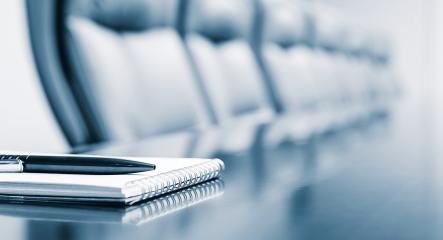 pen in front of chair at a table